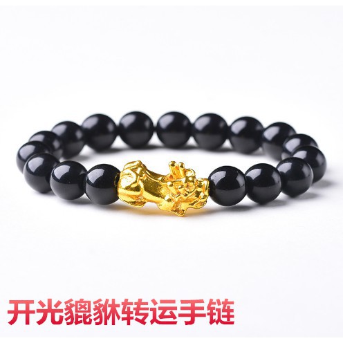 Gold bracelet with black on sale stones