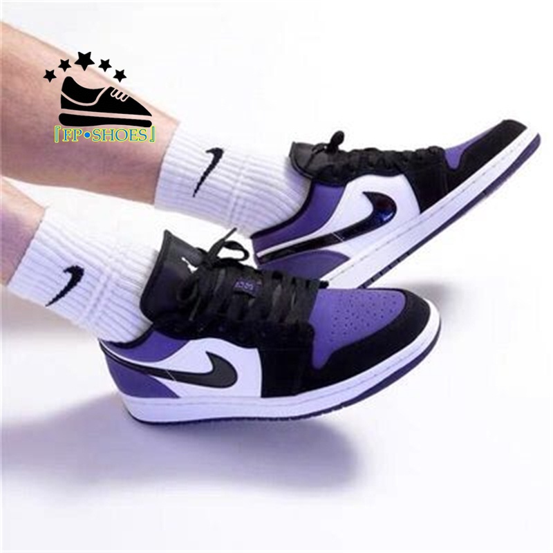 White and black on sale low top jordans