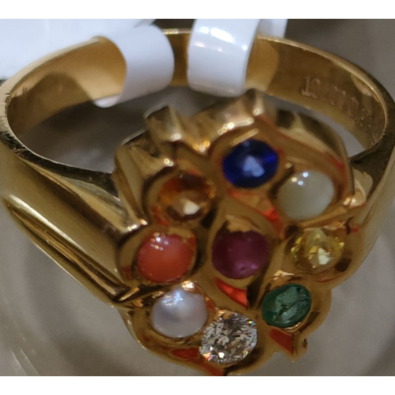 Gold ring with 9 on sale stones