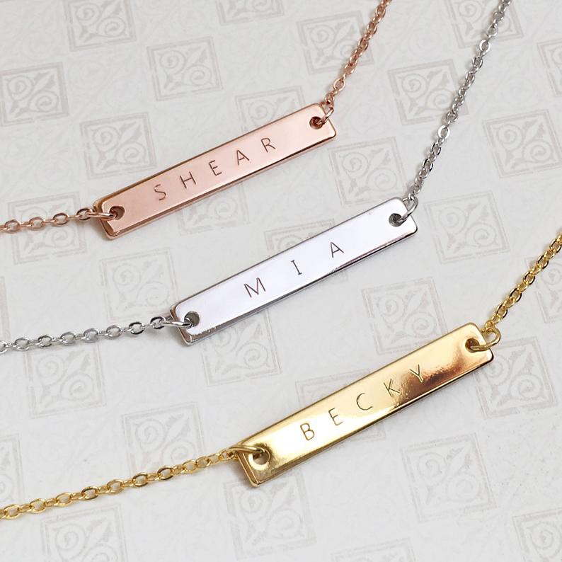 Gold necklace with engraved on sale bar